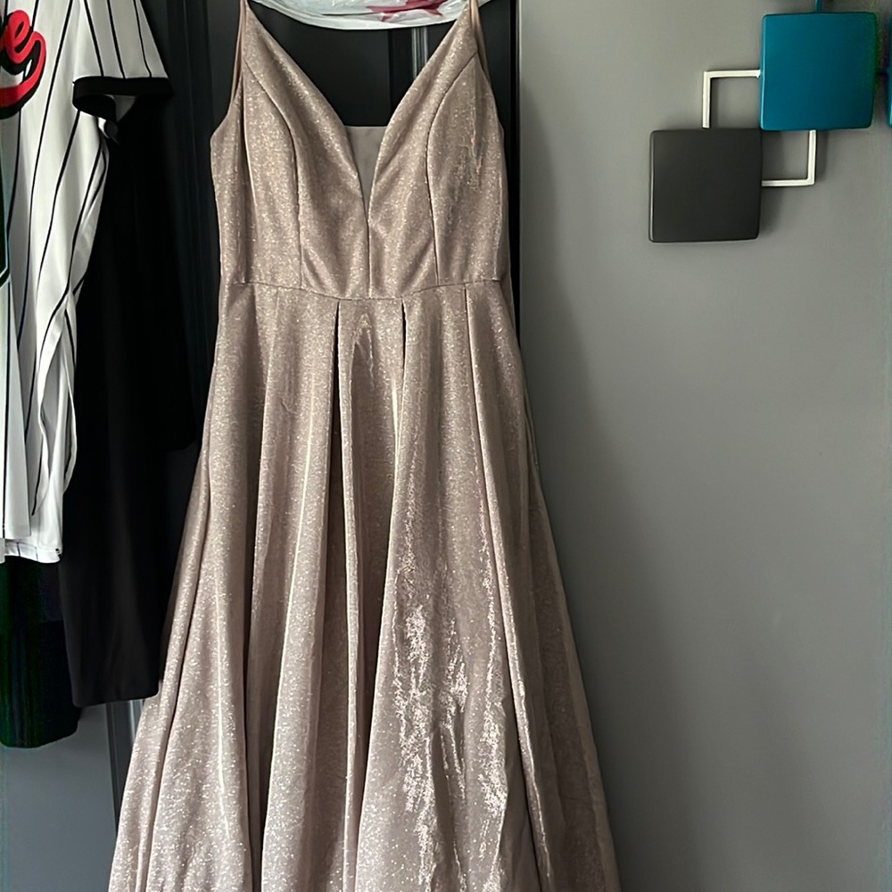 This is a prom dress it is a size 16 it fits smaller the brand is B. Darlin